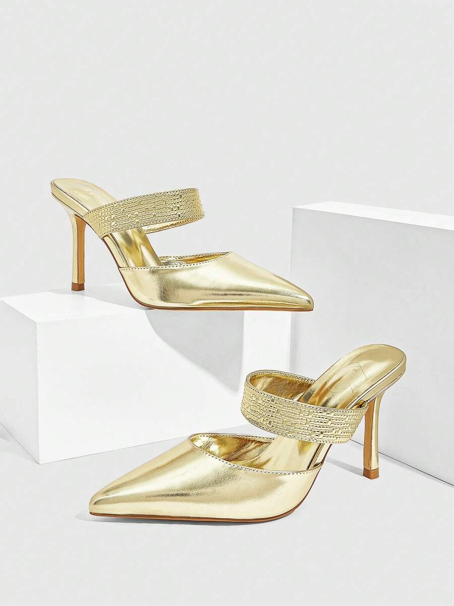 Step into the spotlight with these stunning EleMetallic Gold Pointed Toe Stiletto Pumps—your ticket to holiday glamour! The shimmering metallic gold finish catches every light, while the sharp pointed toe and sleek stiletto heel elongate your silhouette for an undeniably chic look. Perfect for Christmas parties, festive galas, or any occasion calling for show-stopping style. Slip them on and watch heads turn as you command the room with confidence and sparkle. Because the holidays deserve shoes as fabulous 