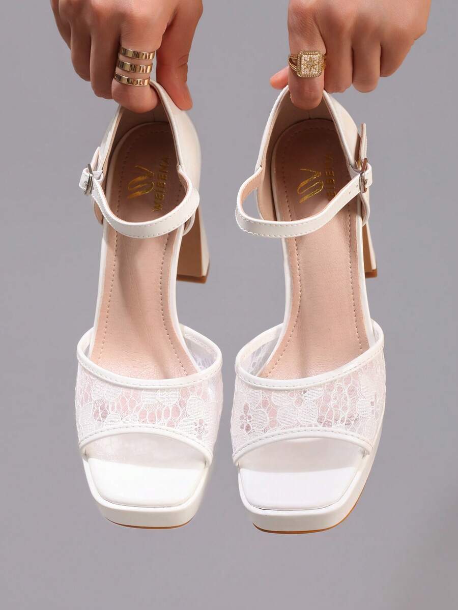 Front view of white lace platform sandals with cushioned beige insoles