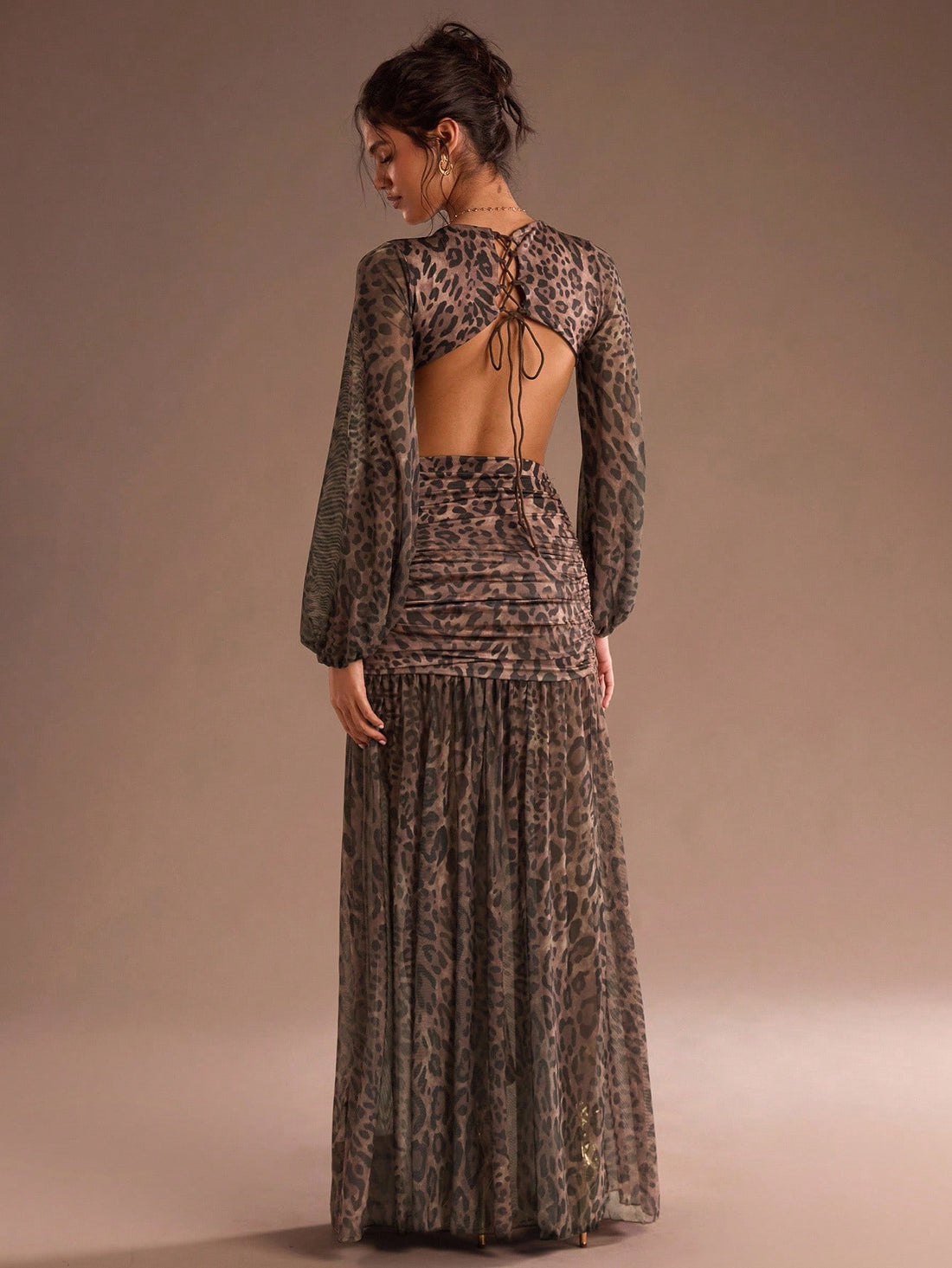 Turn heads at your next event in this stunning leopard print maxi dress. The daring backless design adds instant glamour and sophistication, while the flowing silhouette flatters every figure. Perfect for holiday parties, night outs, or any occasion calling for a show-stopping look. The bold leopard pattern brings wild confidence to your wardrobe, making this dress an unforgettable choice for those ready to make a statement.