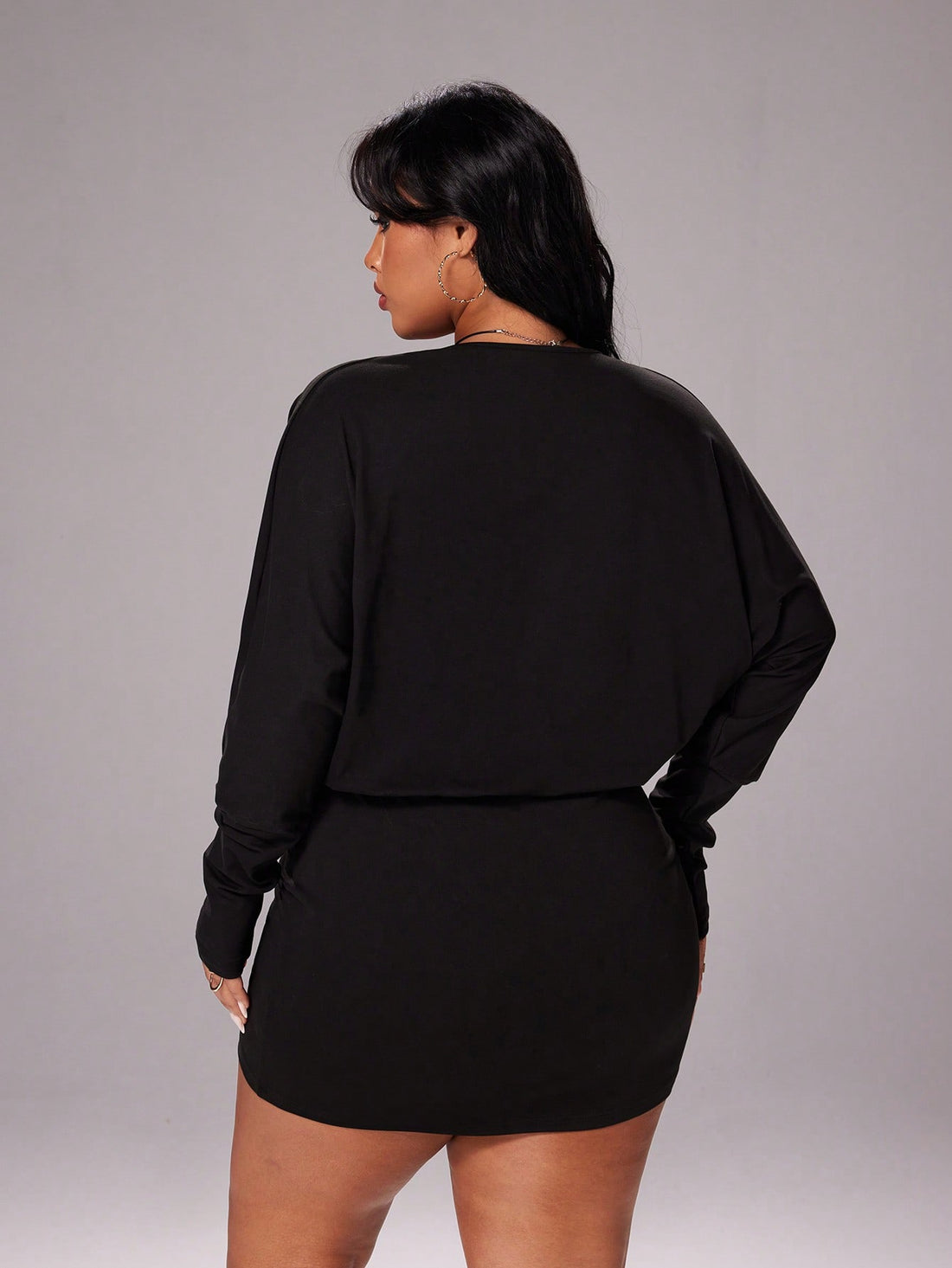 Step into Y2K nostalgia with this chic black long sleeve dress that effortlessly transitions from brunch to night out. The vintage-inspired silhouette flatters every curve, while the timeless black hue pairs with anything in your closet. Whether you're dressing up for a special event or keeping it casual, this plus-size essential delivers that coveted early-2000s vibe with modern comfort. Dress it up with heels and statement jewelry or down with sneakers for an instantly cool look that never goes out of sty