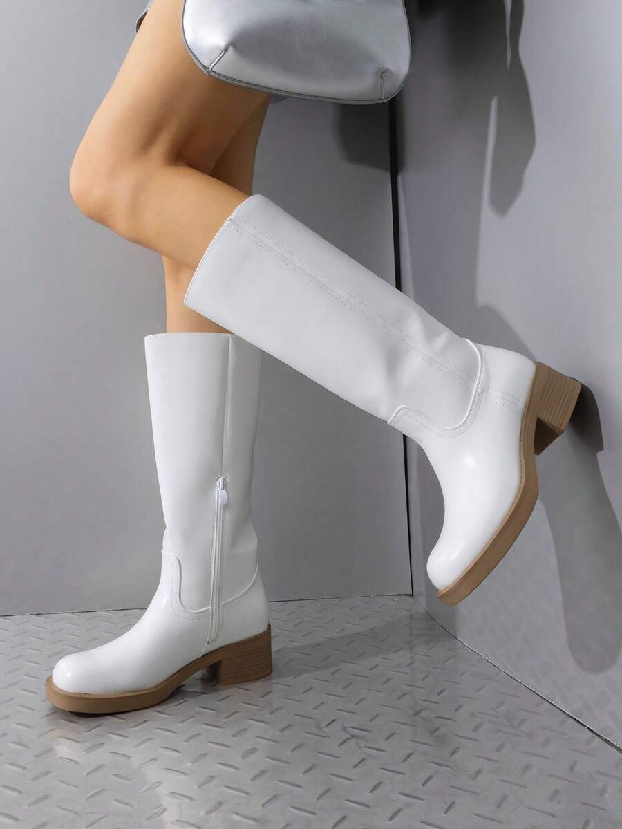 Step into style and comfort with these women's knee-high boots, designed for those who refuse to compromise on either. The sturdy square toe and chunky block heel provide all-day wearability, whether you're running errands or channeling your inner cowgirl. Perfect for casual riding or everyday adventures, these boots deliver the confidence boost you deserve. Slip them on and feel the difference quality craftsmanship makes!