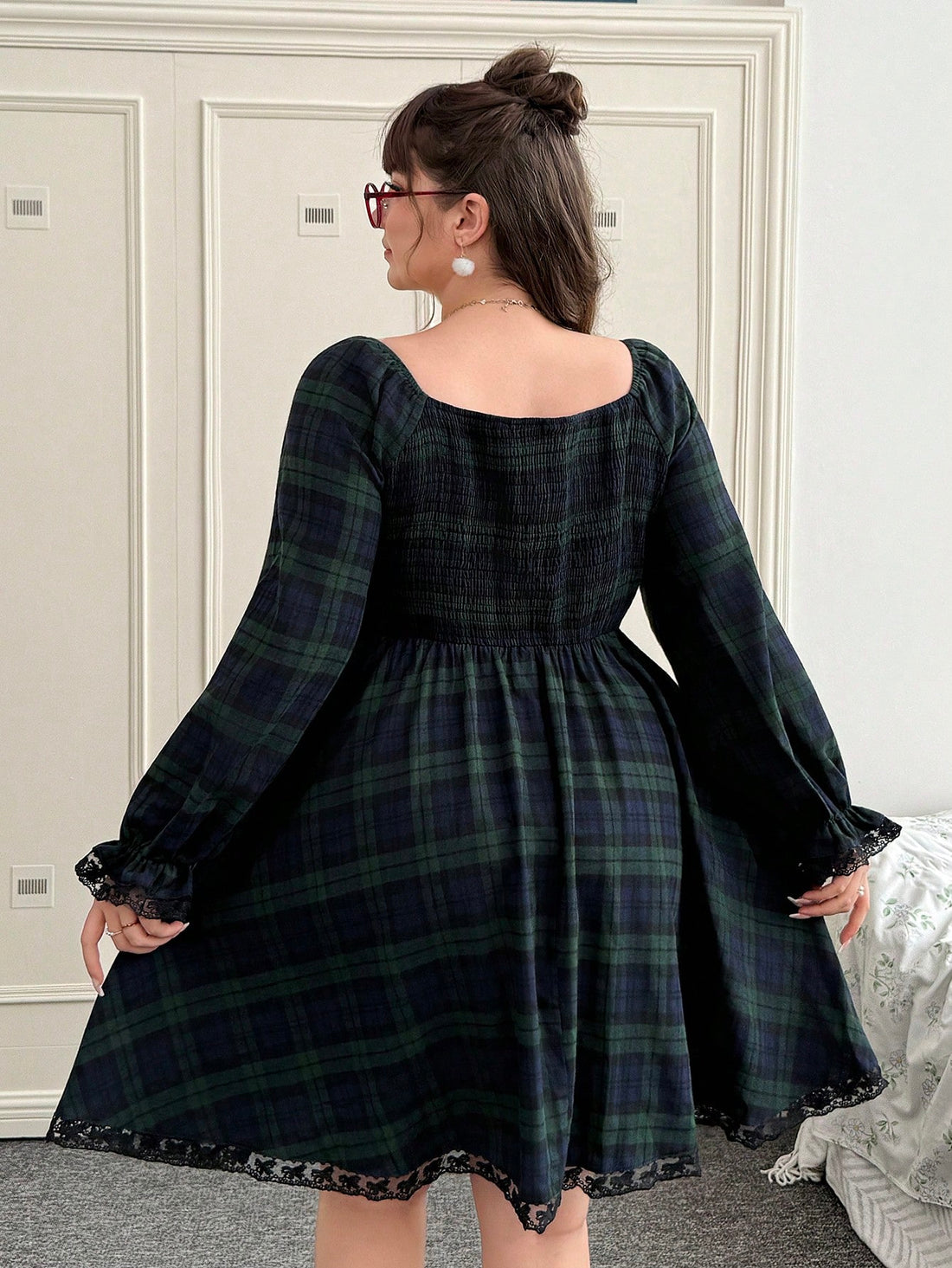 Wrap yourself in festive cheer with this charming plus-size plaid dress! Featuring a classic blue and green checkered pattern, this long-sleeve beauty brings holiday spirit to your winter wardrobe. The relaxed fit flatters all figures while the timeless plaid design works for everything from casual gatherings to cozy nights in. Perfect for spreading seasonal joy without sacrificing comfort or style. Make this your go-to dress for all your merry moments!