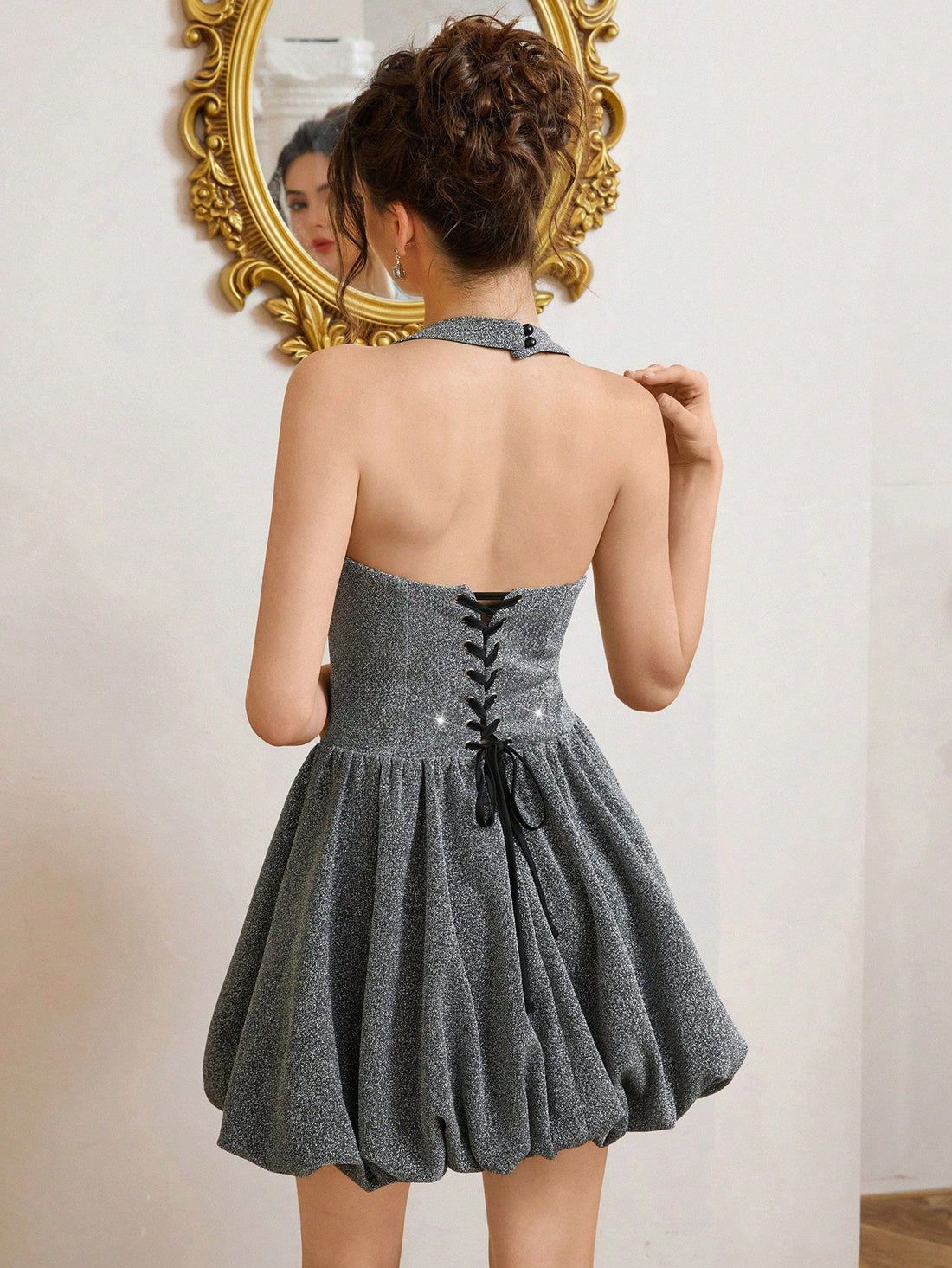 Turn heads at your next celebration in this dazzling sequin mini dress! Featuring a flattering halter neckline and eye-catching silver sequins that catch the light with every move, this party essential combines glamour with comfort. The floral-inspired design adds a touch of elegance while the playful mini cut keeps things fun and flirty. Perfect for cocktail nights, celebrations, or whenever you want to shine. Slip it on and get ready for compliments all night long!