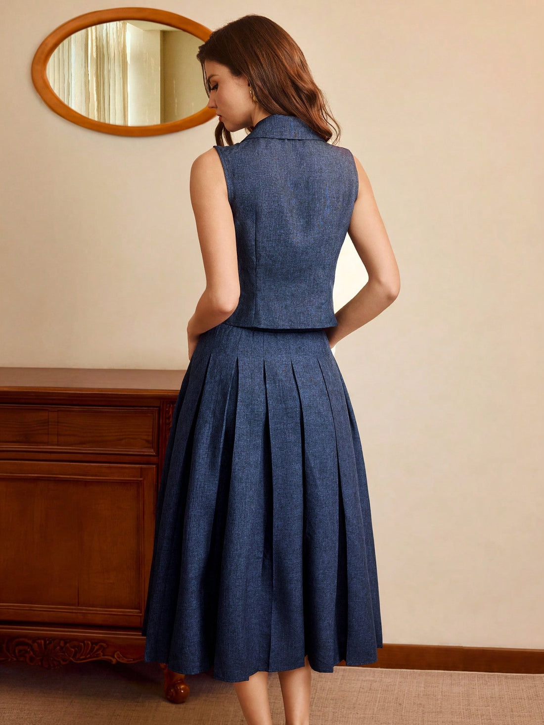 Step back in time with this charming vintage-inspired 2-piece set that brings timeless elegance to your wardrobe. The perfectly fitted navy vest pairs beautifully with a coordinating skirt, creating a polished look that works for brunch dates, office days, or special occasions. This classic combination flatters your silhouette while delivering that coveted retro vibe. Mix and match with your favorite pieces or wear them together for an instantly put-together ensemble that feels both sophisticated and playfu