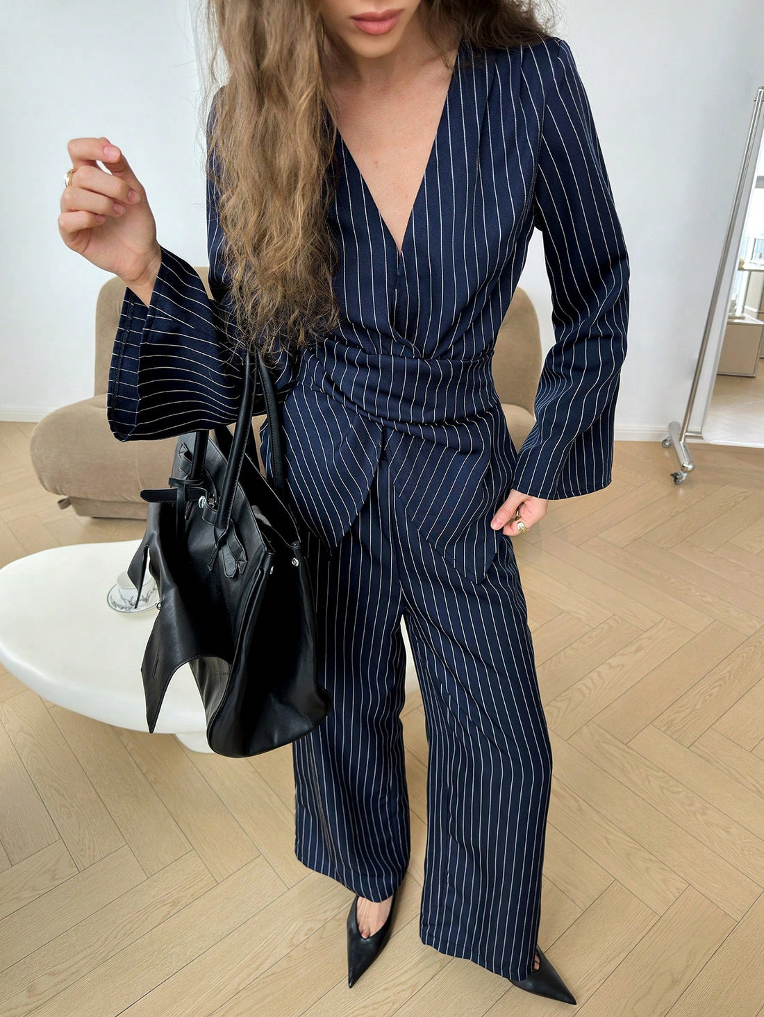 Elevate your weekday wardrobe with this effortlessly chic two-piece set! The crisp blue striped V-neck shirt pairs perfectly with comfortable elastic waist pants, creating a polished look that transitions seamlessly from the office to your commute. Whether you're heading to meetings or grabbing coffee with colleagues, this versatile combo keeps you looking put-together without sacrificing comfort. It's the outfit solution that says "I've got it all figured out"—because honestly, you do.