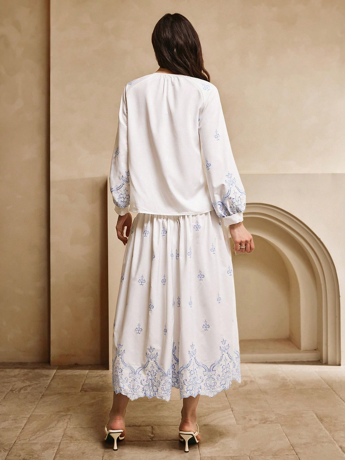 Experience the epitome of bohemian elegance with our 2-piece set featuring a crisp white base and a stunning blue embroidered top and skirt. Perfect for those seeking a unique and playful look. (Effortlessly exude style and charm with this versatile set!)