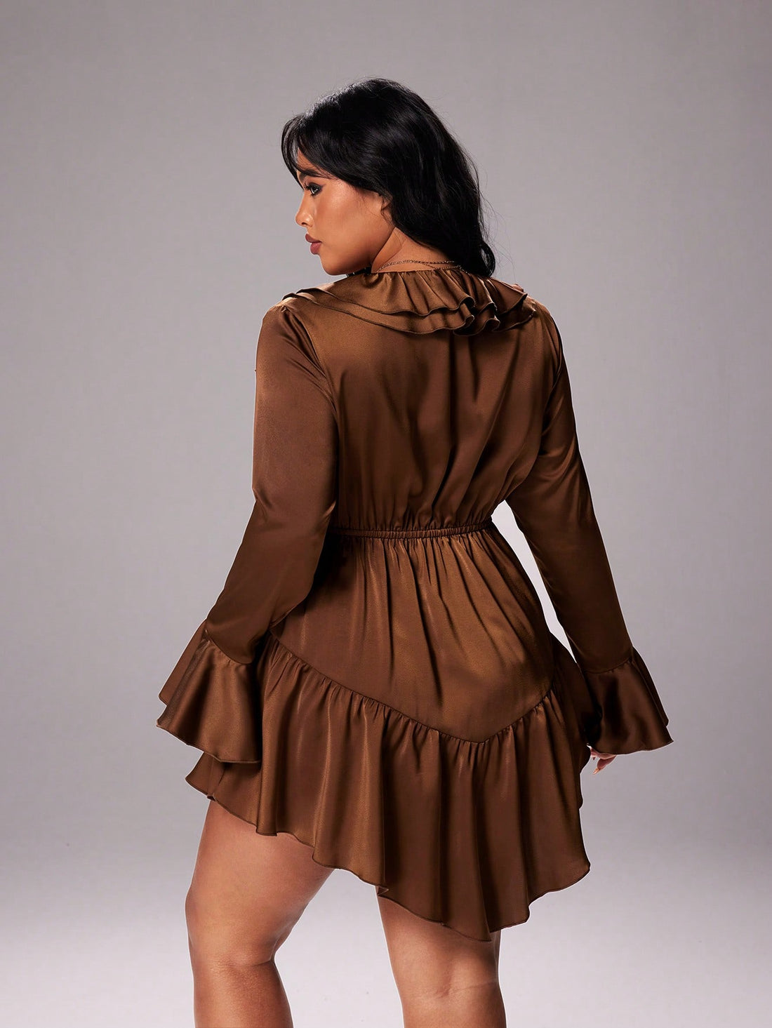 Elevate your wardrobe with this stunning coffee-hued mini dress that's as versatile as it is chic! The flattering V-neckline draws the eye upward, while flare sleeves add a touch of whimsy and movement. A delicate ruffled hem brings playful texture to this plus-size essential that transitions seamlessly from season to season. Whether you're dressing up for a night out or keeping it casual, this dress celebrates your curves with confidence and style. A wardrobe staple that proves elegance has no size limit!