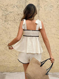 Back view of white tie-strap cami and matching shorts set