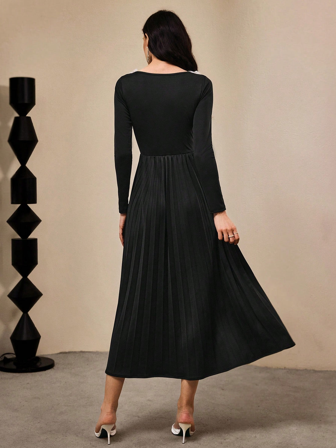 Step into the spotlight in this stunning black evening gown that's pure magic. Intricate 3D floral embellishments dance across the fabric, creating depth and dimension that catches every light in the room. The sleek silhouette flatters your figure while the dramatic length adds that red-carpet glamour you've been craving. Whether you're celebrating the holidays or marking a milestone moment, this dress transforms you into the most elegant version of yourself. It's not just an outfit—it's your ticket to feel