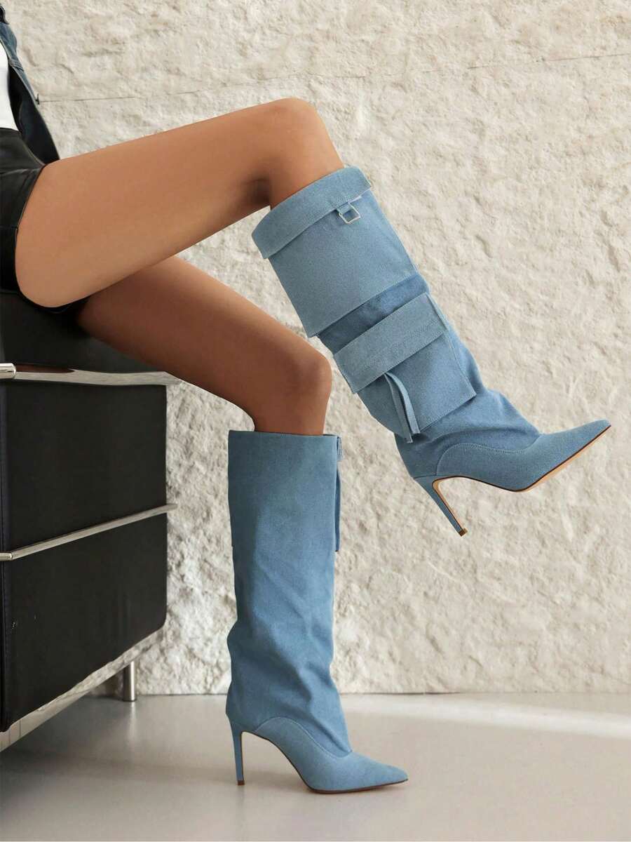 Step into spring and summer with serious style in these knee-high denim cowboy boots. Crafted from classic denim fabric, they feature a sturdy chunky mid heel that keeps you comfortable all day long. The timeless cowboy silhouette pairs perfectly with everything from sundresses to denim shorts, giving you that effortless Western-inspired vibe. Whether you're heading to a music festival, casual brunch, or just want to add some personality to your everyday look, these boots deliver attitude and charm in one f