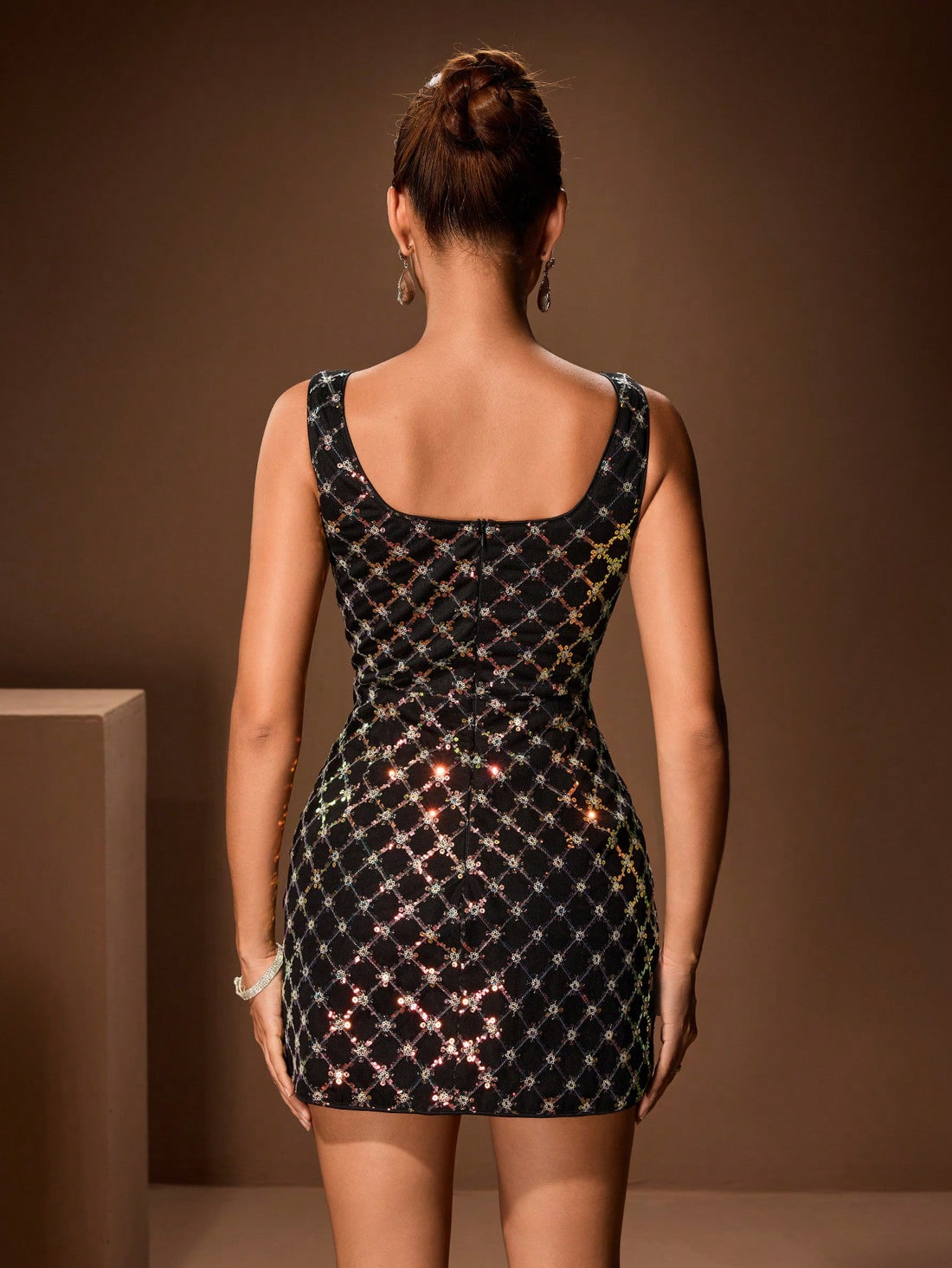 Step into the spotlight with this stunning Glamine sequin party dress that's pure glamour from every angle. Crafted with shimmering sequins that catch the light with every move, this sleek black design transforms you into the star of any celebration. Whether you're dancing the night away or making a grand entrance, the luxe fabric and flattering silhouette ensure you'll feel confident and fabulous. Perfect for cocktail parties, galas, or any occasion that calls for a touch of sparkle and sophistication. Get