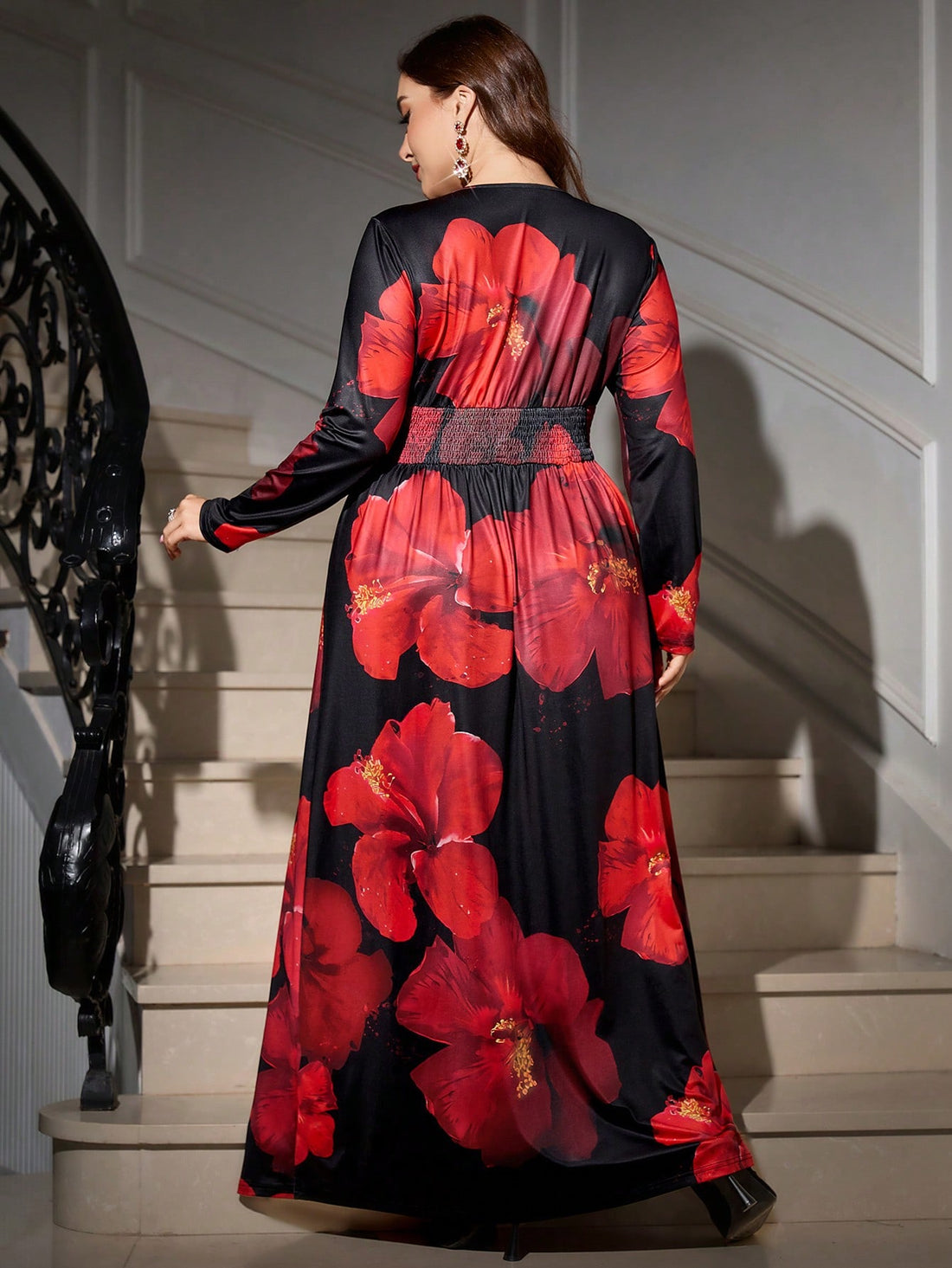 Embrace the season in style with this stunning plus-size maxi dress that's equal parts sophisticated and show-stopping. The rich black backdrop provides the perfect canvas for bold red florals that dance across the fabric, creating a look that's both timeless and on-trend. Whether you're heading to a holiday party, ringing in the New Year, or simply want to feel fabulous this autumn and winter, this dress delivers elegance without compromise. The flowing maxi silhouette flatters every curve while the classi