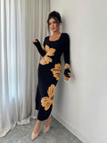 Front full view of black and peach floral square-neck bodycon knit midi dress with long sleeves