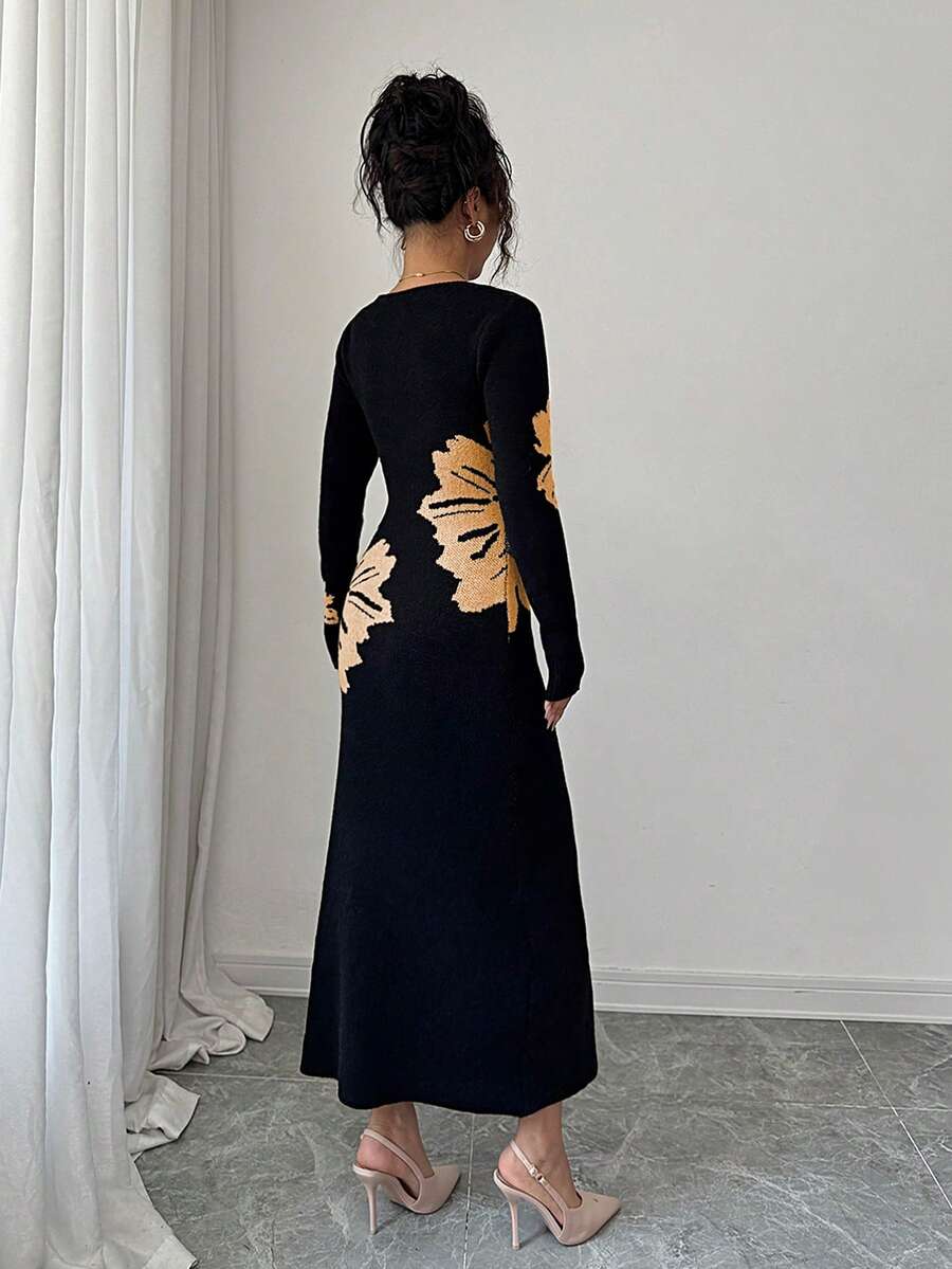Back full view of black and peach floral slim-fit knit midi dress with subtly flared hem