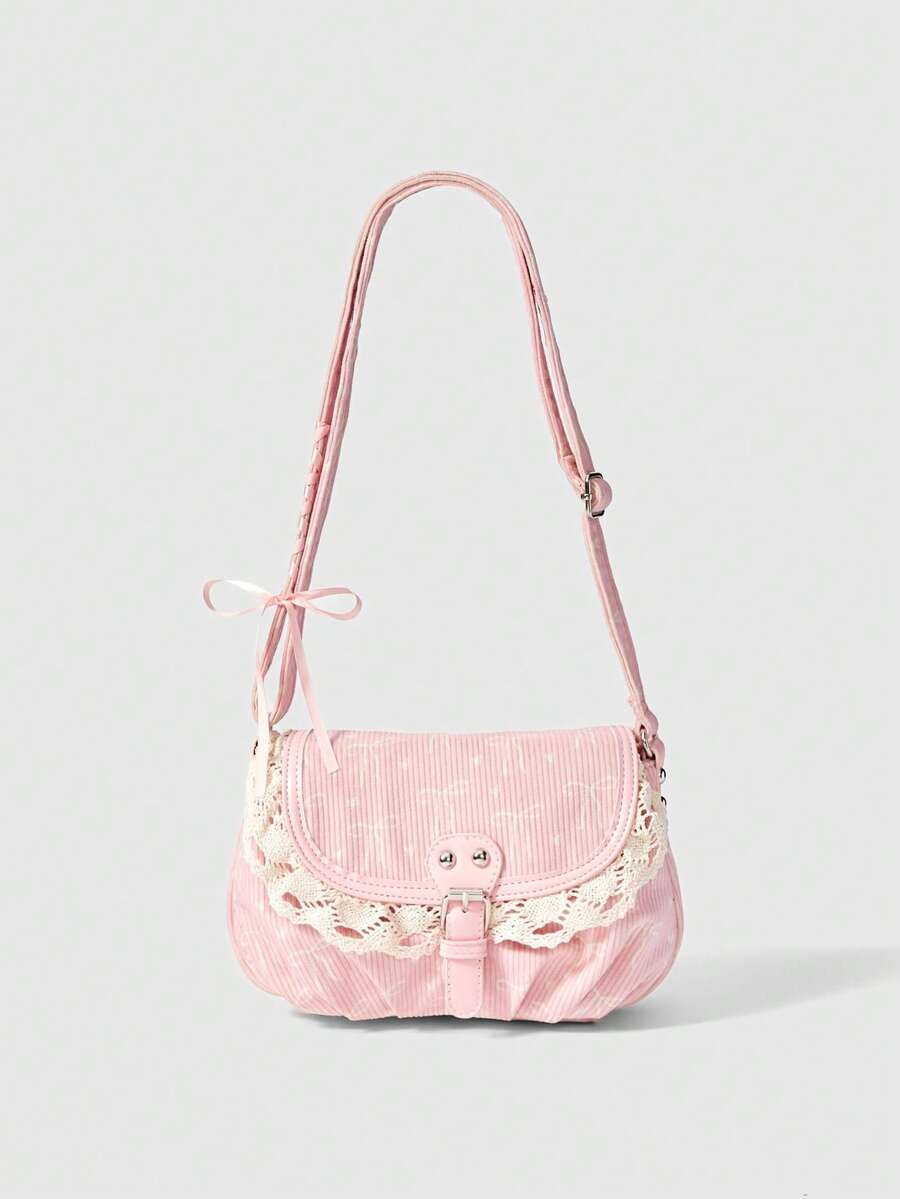 Pink corduroy shoulder bag with faint white print lace trim and buckle strap