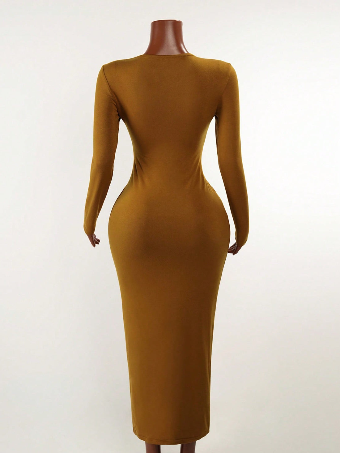 Elevate your everyday wardrobe with this fitted long sleeve dress that strikes the perfect balance between polished and laid-back. The chic metal decor detailing adds just the right amount of sparkle without stealing the show, making it your go-to piece for everything from casual coffee runs to weekend hangouts. The fitted silhouette flatters your figure while the long sleeves keep things cozy and versatile. Dress it up with heels and jewelry or keep it casual with sneakers—this effortless beauty adapts to 