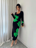 Front full view of black and green floral square-neck bodycon knit midi dress with long sleeves