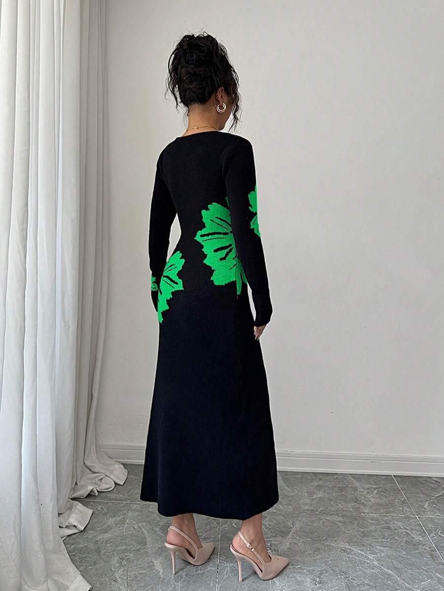 Back full view of black and green floral slim-fit knit midi dress with subtly flared hem