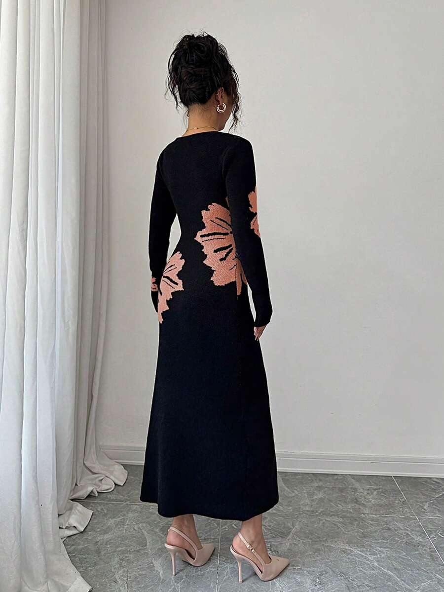 Back full view of black and peach floral slim-fit knit midi dress with subtly flared hem