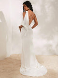 White open back maxi dress with crossed straps and rosette detail