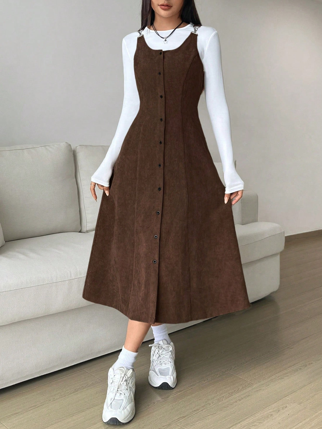 Step into retro charm with this plus-size corduroy dress that's twice the fun—literally! Rock it one way for a classic vintage vibe, then flip it for a completely different look. The sleek button closure keeps everything secure while the reversible design means you're getting two dresses in one. Perfect for layering through autumn and winter, this timeless piece celebrates your style with serious personality. Who says you can't have it both ways?