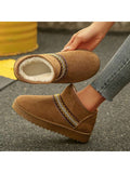 Side pair view of camel ankle boots showing lined openings and tread
