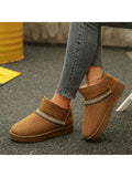 Outdoor side view of camel suedette ankle boots with rounded toes