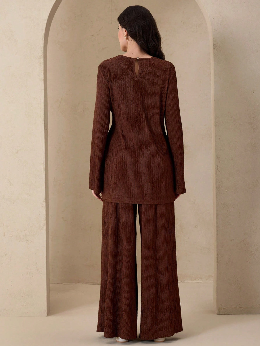 Embrace the season in this effortlessly chic two-piece set that's giving cozy-meets-sophisticated vibes. The rich coffee brown hue pairs beautifully with textured fabrics that add dimension and visual interest, while subtle metal accents elevate the casual aesthetic with just a hint of edge. Perfect for layering through autumn, this versatile outfit transitions seamlessly from weekend errands to casual hangouts. The relaxed fit keeps things comfortable without sacrificing style, making it your new go-to for