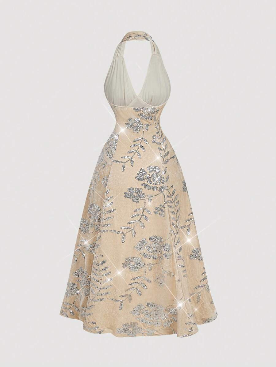 Elevate your evening wardrobe with this sophisticated velvet sequin halter dress, designed to make a statement at any celebration. The luxurious velvet fabric combined with shimmering sequin detailing creates an eye-catching contrast that catches light beautifully throughout the night. The halter neckline offers elegant support while showcasing your shoulders, making it ideal for holiday parties, New Year's Eve galas, and formal occasions. The dress drapes gracefully to create a flattering silhouette that w