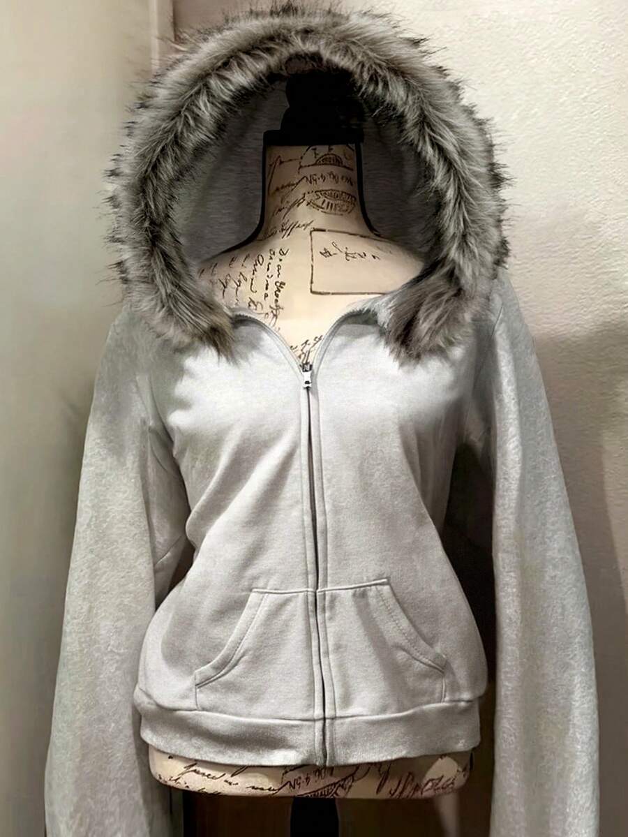Front view of light grey hooded zip-up jacket with faux-fur trim and pockets