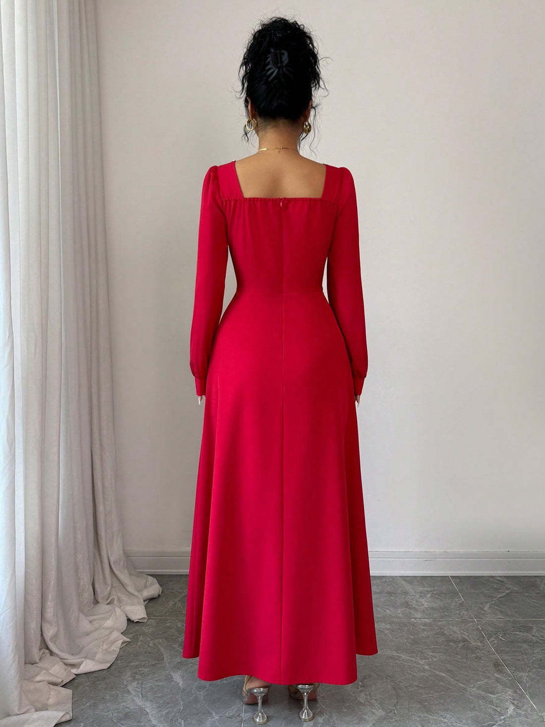 Step into the season's most glamorous moment in this stunning red maxi dress. The sophisticated square neckline frames your shoulders beautifully while the flowing silhouette creates an effortlessly elegant look that turns heads at every celebration. Whether you're ringing in the New Year or dancing through Christmas festivities, this dress delivers that perfect blend of timeless charm and modern flair. Slip it on and let the compliments roll in—because looking this fabulous should feel this easy!