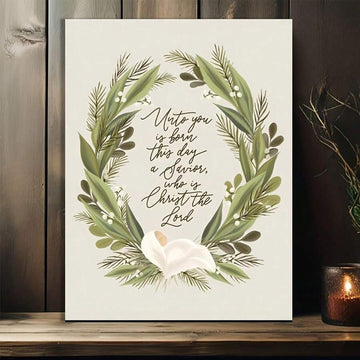 Nativity verse canvas art with green wreath and white lily on wood shelf