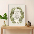 Christian nativity scripture canvas art above a light room console