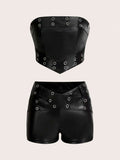 Front flat-lay view of black faux-leather bandeau and angled-waist shorts set