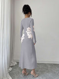 Back full view of light grey and cream floral slim-fit knit midi dress with subtly flared hem