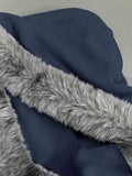 Close view of navy blue zip-up hoodie fabric and grey faux-fur hood trim