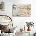Boho room view of coastal beach wall art above rattan chair