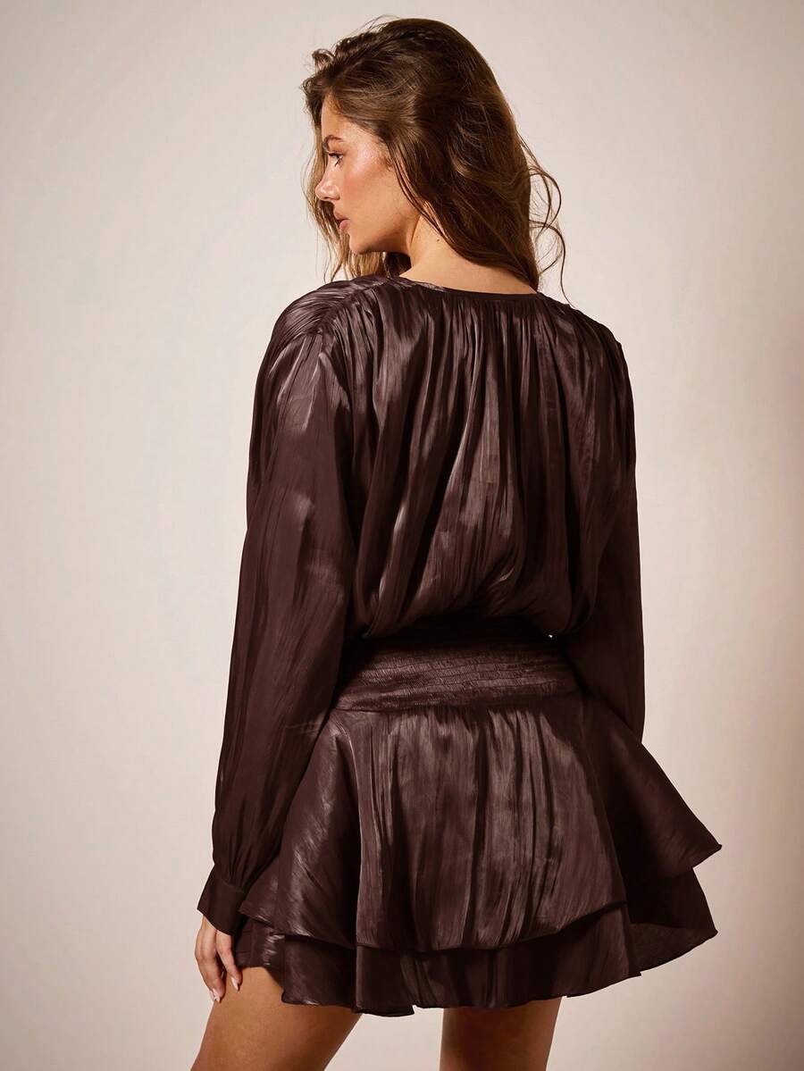 Raise a glass to holiday glamour in this stunning burgundy dress that's equal parts sophisticated and fun. The charming tie collar adds a flirty touch, while the playful ruffle hem keeps things festive without taking itself too seriously. Perfect for Christmas parties, family gatherings, or anywhere you want to make a merry entrance. Slip into elegance and let the season's spirit shine through your style.