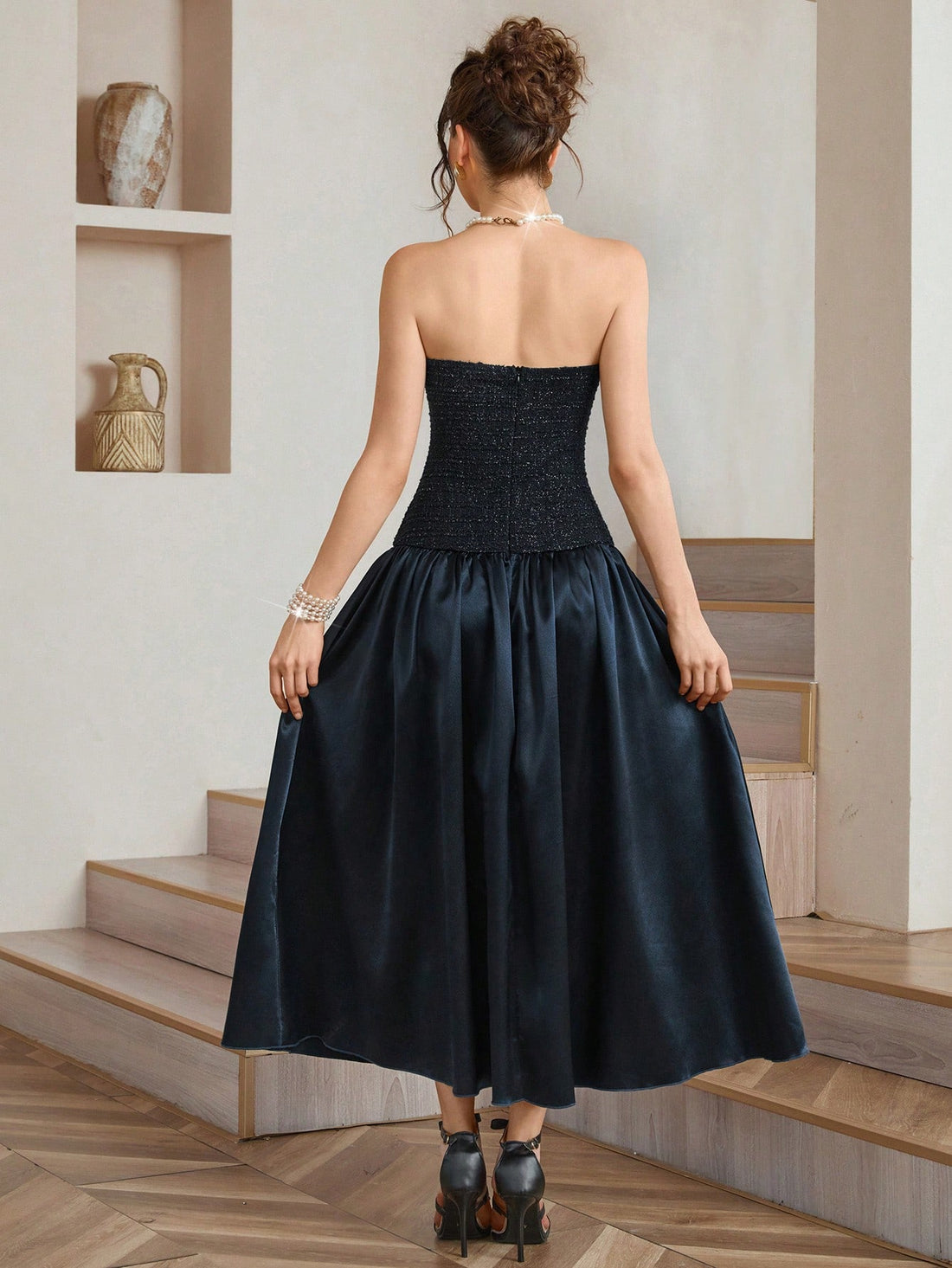 Elevate your holiday wardrobe with this stunning navy blue knit patchwork dress that's equal parts sophisticated and fun. The thoughtfully mixed textures create visual interest while the cinched waist belt flatters your silhouette and adds a polished finishing touch. Whether you're dancing at a Christmas party or enjoying festive gatherings, this versatile piece transitions seamlessly from celebration to celebration. The rich navy hue pairs beautifully with statement jewelry and heels, making it your go-to 