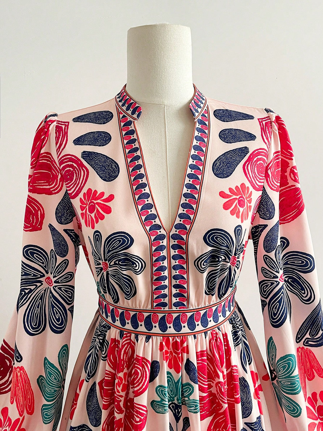 Embrace your free-spirited style with this vibrant floral bohemian dress! Featuring a stunning array of colors and intricate patterns, this long-sleeve beauty transitions seamlessly from fall into winter. The relaxed, flowing silhouette offers all-day comfort while the rich botanical prints add an artistic flair to your wardrobe. Perfect for layering with boots and a cozy cardigan, this dress celebrates individuality and effortless elegance. Whether you're heading to brunch or a casual gathering, this boho 