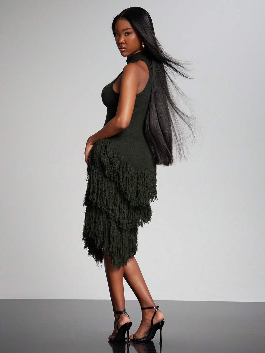 Elevate your evening look with this sophisticated sleeveless turtle neck bodycon dress. Crafted from 100% polyester with a subtle stretch, it hugs your silhouette beautifully while maintaining comfort. The long pencil hem and eye-catching fringe details create an elegant, statement-making style perfect for formal occasions and festive celebrations. The slim fit design flatters your figure, while the rich green hue works seamlessly for fall and winter wardrobes. Hand wash or professionally dry clean to maint