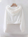 Back view of white hooded zip-up jacket with faux-fur trim and cropped styling