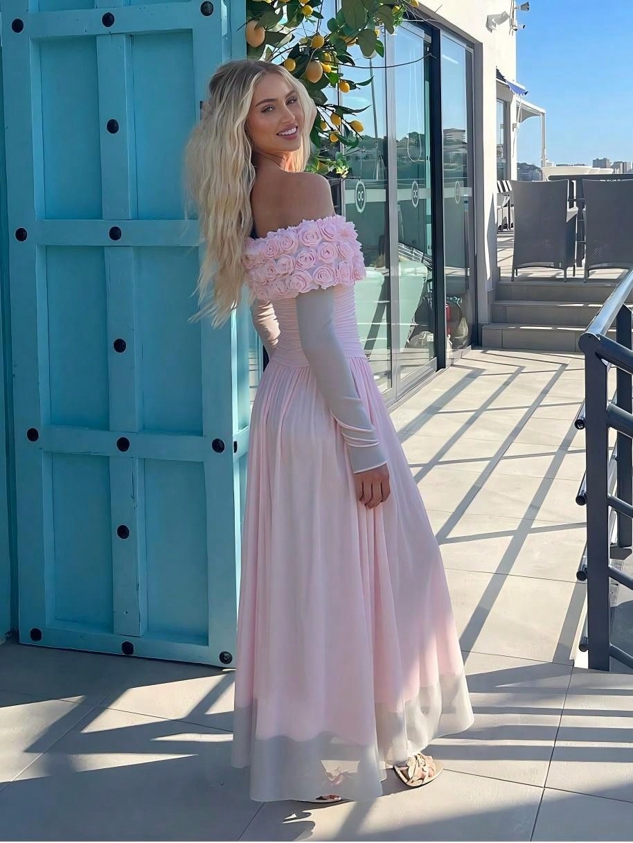 Slip into sophistication with this stunning off-shoulder knit maxi dress, where delicate rose flower details add a romantic flourish to your special moments. The soft, stretchy knit fabric hugs your curves beautifully while the flowing maxi silhouette creates an effortlessly graceful look. Perfect for weddings, galas, or any occasion that calls for elegance with a touch of whimsy. The off-shoulder neckline frames your shoulders beautifully, making this dress an instant showstopper that'll have everyone aski