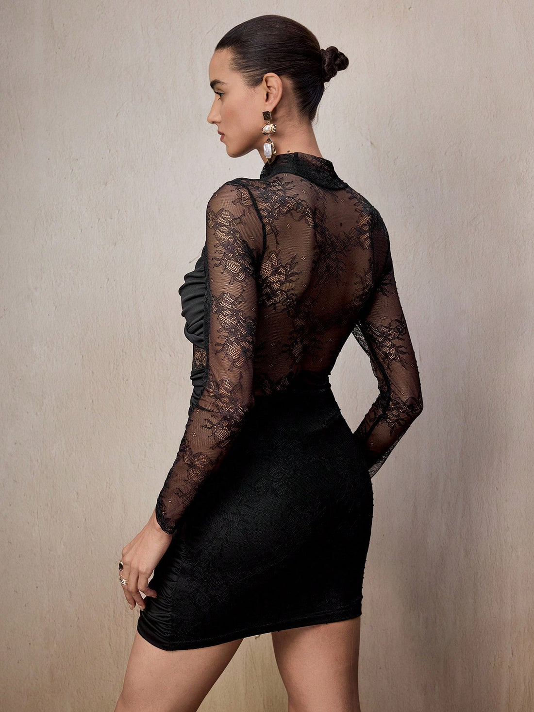 Turn heads and own the night in this stunning bodycon mini dress that perfectly blends elegance with edge. Featuring intricate lace patchwork details against a sleek silhouette, this dress hugs your curves in all the right ways while the lace accents add a touch of sophisticated allure. Whether you're hitting the club, catching a night out with friends, or making a grand entrance at an event, this versatile piece delivers major confidence and undeniable style. Dress it up with heels and statement jewelry fo