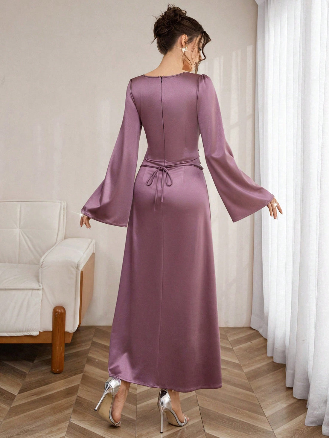 Slip into sophistication with this stunning shiny knit bodycon maxi dress that hugs your curves in all the right ways. The eye-catching tie-up shoulders add a flirty, modern twist, while luxurious long sleeves keep things elegant and refined. Perfect for date nights, special occasions, or whenever you want to turn heads, this dress combines comfort with undeniable glamour. The lustrous fabric catches the light beautifully, ensuring you'll shine from every angle. A wardrobe essential that proves you can be b