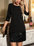 Front view of black short dress with all-black sequin cuffs and hem