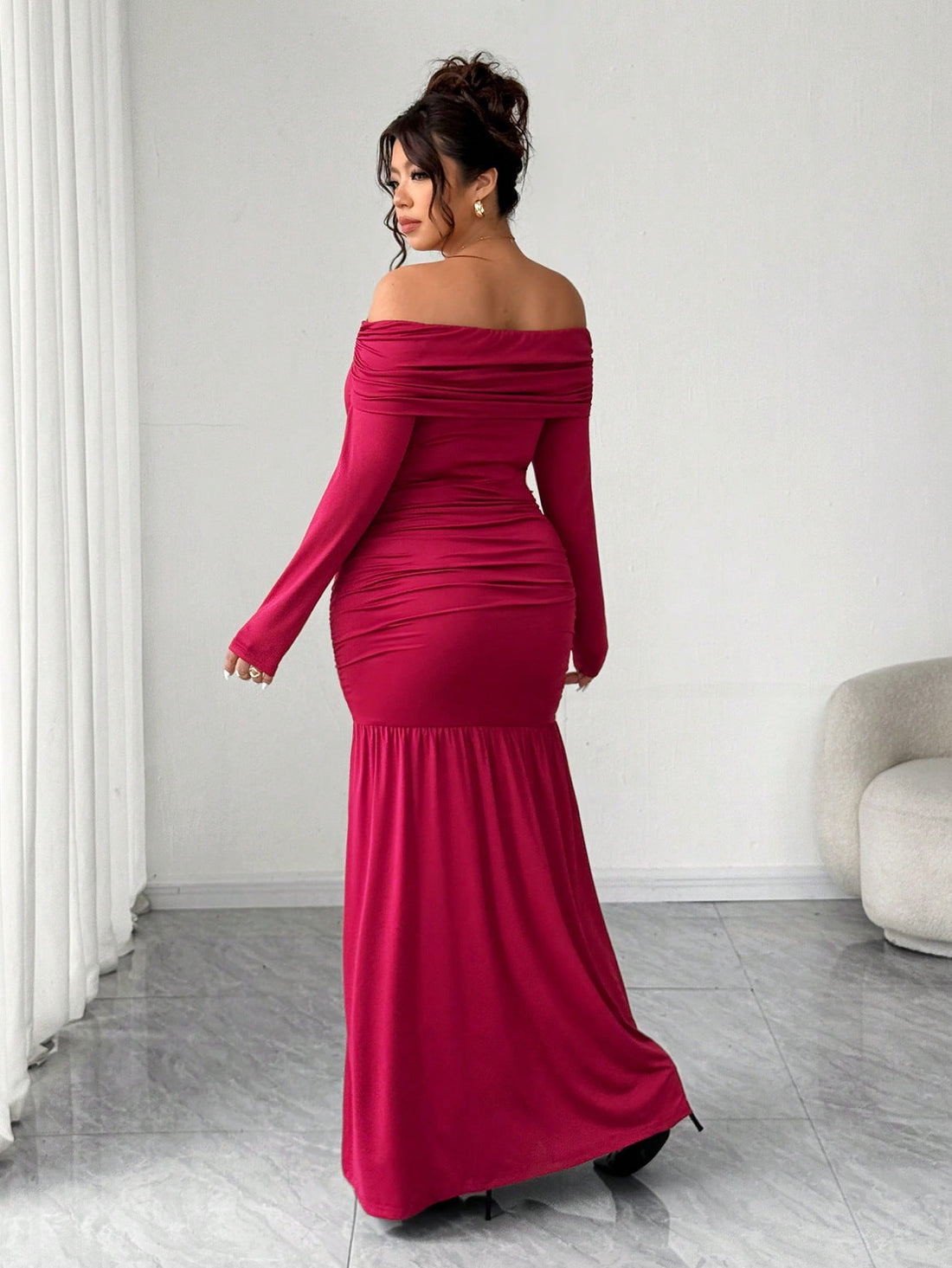 Make a statement at your next celebration in this stunning off-shoulder dress designed for curves and confidence. The cinched waist creates a flattering silhouette while the asymmetric hem adds an unexpected twist of modern flair. Soft, flowing fabric drapes beautifully, letting you move and dance with ease. Perfect for parties, weddings, or any occasion where you want to feel absolutely fabulous. Available in plus sizes because every body deserves to shine.