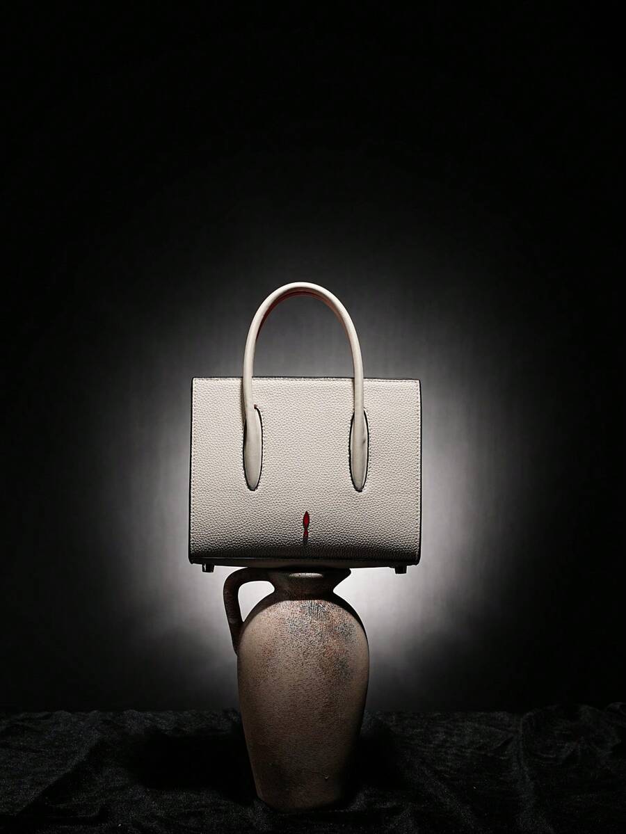 Elevate your everyday style with this chic square handbag that's equal parts sophisticated and fun. Crafted in pristine white, this medium tote strikes the perfect balance between spacious and sleek—roomy enough for your essentials, compact enough to feel effortlessly elegant. The customizable logo option lets you add a personal touch that's uniquely yours, making it the ideal accessory for anyone who refuses to blend in. Whether you're heading to brunch, the office, or weekend adventures, this luxury piece