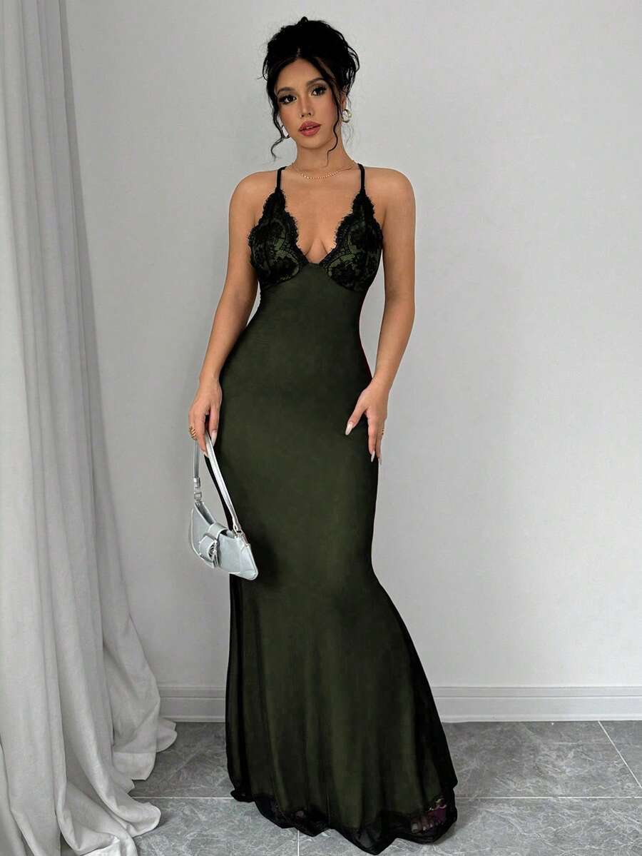 Turn heads in this sultry slip dress that's equal parts elegance and edge. The delicate lace V-neckline draws eyes forward while the daring backless design with criss-cross straps keeps things mysterious. A bodycon fit hugs your curves in all the right ways, flowing into a dramatic mermaid hem that commands attention as you move. Perfect for nights when you want to feel confident, bold, and absolutely unforgettable.