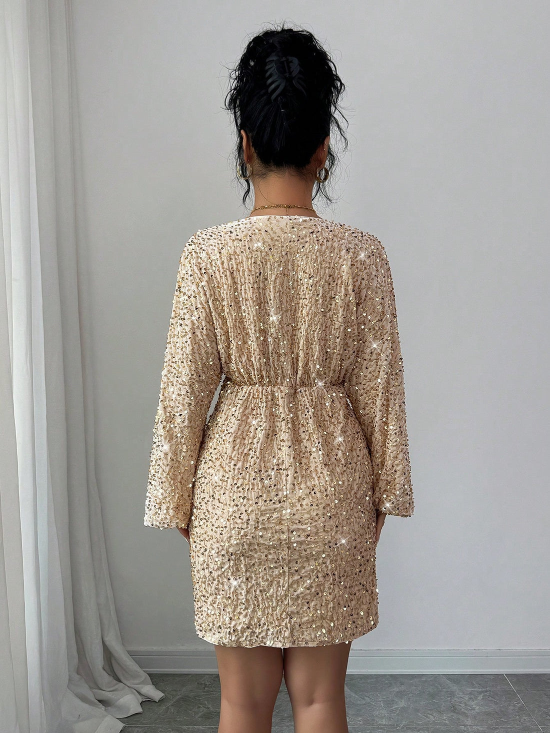 Shimmer into the season with this show-stopping sequin dress that channels vintage glamour with a modern twist. Crafted for those magical fall and winter moments—whether you're dancing at holiday parties or stealing the spotlight at celebrations—this dress delivers sparkle and sophistication in one stunning package. The sequin detailing catches light beautifully, creating an eye-catching effect that's sure to turn heads. Perfect for anyone who believes getting dressed up should be fun, fabulous, and absolut